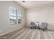 Cozy sitting room with comfortable seating and a view of the backyard pool at 20914 W Cora Vis, Buckeye, AZ 85396