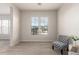 Bright sitting room offering two windows with views and comfortable seating at 20914 W Cora Vis, Buckeye, AZ 85396