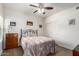 Bedroom with a queen-size bed and wood dresser at 21320 N 56Th St # 1119, Phoenix, AZ 85054