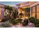 Charming courtyard with lush landscaping and lighting at 24652 N 111Th Pl, Scottsdale, AZ 85255