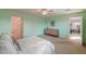 Airy bedroom with a large dresser and closet space featuring a calming light green color scheme at 2565 E Southern Ave # 102, Mesa, AZ 85204