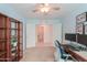 Bedroom with a ceiling fan, an airy feel, a desk and shelving provides ample space and functional design at 2565 E Southern Ave # 102, Mesa, AZ 85204