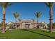 Community clubhouse with lawn and palm trees at 26021 N 23Rd Ave, Phoenix, AZ 85085