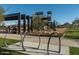 Modern playground with play structures, shaded areas, and bike racks at 26021 N 23Rd Ave, Phoenix, AZ 85085