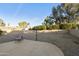 Landscaped backyard with gravel and a relaxing patio area at 26622 S Beech Creek Dr, Sun Lakes, AZ 85248