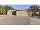 Tan house with attached two-car garage at 26622 S Beech Creek Dr, Sun Lakes, AZ 85248