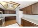 Traditional kitchen with wood cabinets, white appliances, and ample counter space at 26622 S Beech Creek Dr, Sun Lakes, AZ 85248