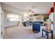 Living room with tile floors and view into kitchen at 3358 N 147Th Ln, Goodyear, AZ 85395