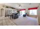 Bright living room with tile floors, a ceiling fan, and sliding glass doors at 3358 N 147Th Ln, Goodyear, AZ 85395