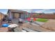 Backyard with synthetic grass, patio and gravel at 346 E Tahiti E Dr, Casa Grande, AZ 85122