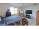 Comfortable bedroom with a queen bed, large window, dresser, and ample space at 346 E Tahiti E Dr, Casa Grande, AZ 85122