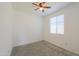 Bedroom with a ceiling fan, light carpet and window at 346 E Tahiti E Dr, Casa Grande, AZ 85122