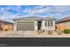 Charming single-story home featuring a two-car garage and desert landscaping at 346 E Tahiti E Dr, Casa Grande, AZ 85122