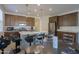 Bright kitchen and dining area featuring an island with seating and stainless appliances at 346 E Tahiti E Dr, Casa Grande, AZ 85122