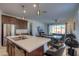 Open concept kitchen with stainless steel appliances and island seating at 346 E Tahiti E Dr, Casa Grande, AZ 85122