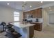 Cozy kitchen with stainless steel appliances, an island and pendant lighting at 346 E Tahiti E Dr, Casa Grande, AZ 85122