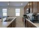 Well-lit kitchen featuring stainless steel appliances and modern finishes at 346 E Tahiti E Dr, Casa Grande, AZ 85122