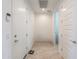 Functional mud room area featuring tile flooring, white doors, and a keypad lock system at 346 E Tahiti E Dr, Casa Grande, AZ 85122