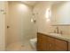Modern bathroom featuring a glass enclosed shower, sleek vanity, and minimalist design at 3643 E Coolidge St, Phoenix, AZ 85018
