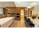 Gourmet kitchen features custom cabinets, modern appliances, an eat-in area and tons of natural light at 3643 E Coolidge St, Phoenix, AZ 85018