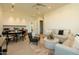 Cozy living room with stylish furnishings and a view of the adjacent dining area at 3643 E Coolidge St, Phoenix, AZ 85018