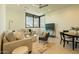 Comfortable living room featuring modern decor and a large window with neighborhood views at 3643 E Coolidge St, Phoenix, AZ 85018