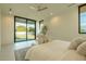 Bright main bedroom with a large sliding glass door to the backyard and neutral decor at 3643 E Coolidge St, Phoenix, AZ 85018