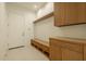 Well-organized mudroom with custom cabinetry, storage bench, and direct access to the home at 3643 E Coolidge St, Phoenix, AZ 85018