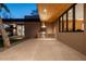 Covered patio with an outdoor kitchen featuring a built-in grill, brick accents, and wood ceilings at 3643 E Coolidge St, Phoenix, AZ 85018