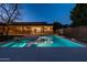 Backyard pool and spa with modern home and landscaping reflecting in the water at dusk at 3643 E Coolidge St, Phoenix, AZ 85018