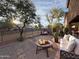 Inviting backyard featuring comfortable seating, mature trees, and a tranquil setting perfect for relaxation at 4114 S Sawmill Rd, Gilbert, AZ 85297