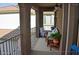 Relaxing balcony with comfortable seating, a hanging chair, and outdoor decor at 4114 S Sawmill Rd, Gilbert, AZ 85297