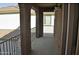 This balcony is enclosed with a black metal railing and has a concrete floor at 4114 S Sawmill Rd, Gilbert, AZ 85297