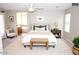 Serene bedroom with a plush bed, neutral tones, and access to an en-suite bathroom at 4114 S Sawmill Rd, Gilbert, AZ 85297