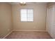 This carpeted bedroom has a window and closet with sliding doors at 4114 S Sawmill Rd, Gilbert, AZ 85297