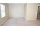 The large bedroom boasts neutral carpet and paint and a large window for natural light at 4114 S Sawmill Rd, Gilbert, AZ 85297