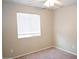 The bedroom has a ceiling fan and a large window at 4114 S Sawmill Rd, Gilbert, AZ 85297