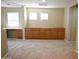 Bright bonus room features neutral carpet, built in cabinets and desk plus lots of natural light at 4114 S Sawmill Rd, Gilbert, AZ 85297