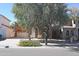 Two-story home featuring a clay tile roof, a front-facing balcony, an arched entryway and a two-car garage at 4114 S Sawmill Rd, Gilbert, AZ 85297