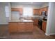 Open kitchen features a granite island countertop, stainless steel appliances, and wood cabinets at 4114 S Sawmill Rd, Gilbert, AZ 85297