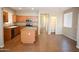 Open kitchen with granite island countertop, stainless steel appliances, wood cabinets and tile floors at 4114 S Sawmill Rd, Gilbert, AZ 85297