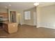 Open kitchen and dining area features a granite island countertop and tile floors at 4114 S Sawmill Rd, Gilbert, AZ 85297