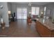Open-concept living room featuring tile flooring, a sliding glass door, and stylish decor at 4114 S Sawmill Rd, Gilbert, AZ 85297