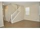 Open living space featuring a staircase, tile flooring, neutral colored walls, and bright windows at 4114 S Sawmill Rd, Gilbert, AZ 85297