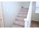 Carpeted staircase features white risers and baseboards, and light-colored walls at 4114 S Sawmill Rd, Gilbert, AZ 85297