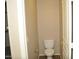 This half-bathroom has a toilet and tile flooring at 4114 S Sawmill Rd, Gilbert, AZ 85297