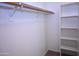 This walk-in closet has shelving and a hanging rod at 4114 S Sawmill Rd, Gilbert, AZ 85297
