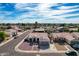 Aerial view of a house with solar panels and a neighborhood in the background at 5003 W Davis Rd, Glendale, AZ 85306