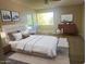 Bright bedroom with a comfortable bed, ample natural light, and built-in dresser at 5150 N 20Th St # 201, Phoenix, AZ 85016