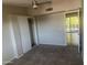 Well-lit bedroom with sliding closet doors and carpet flooring at 5150 N 20Th St # 201, Phoenix, AZ 85016
